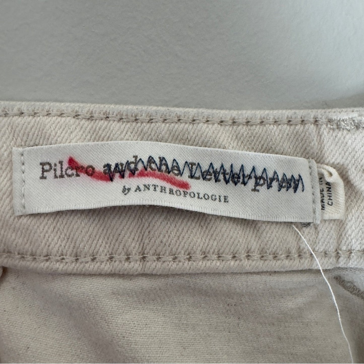Pilcro and the Letterpress Anthropologie faded tie dye jeans mom baggy pleated