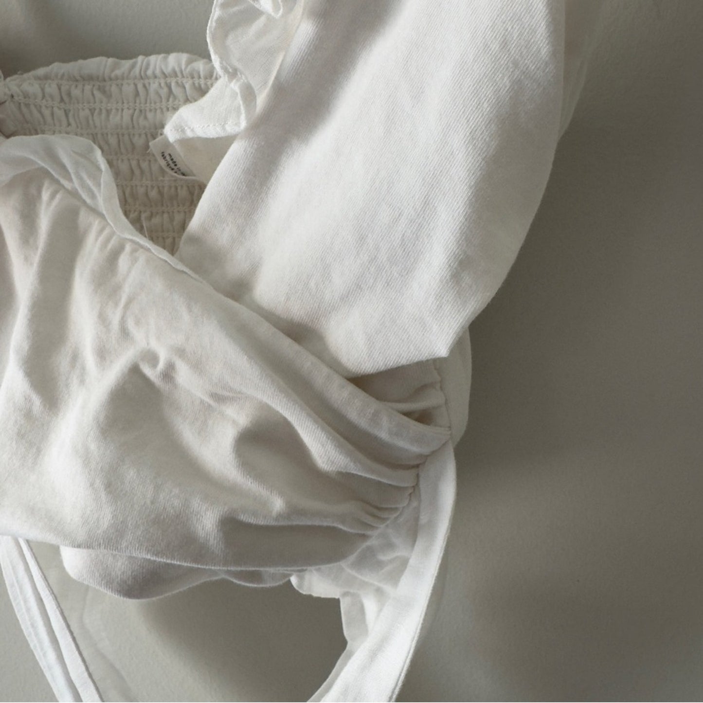 Anthropologie White tie wrap Smocked back crop Top adjustable spaghetti straps M