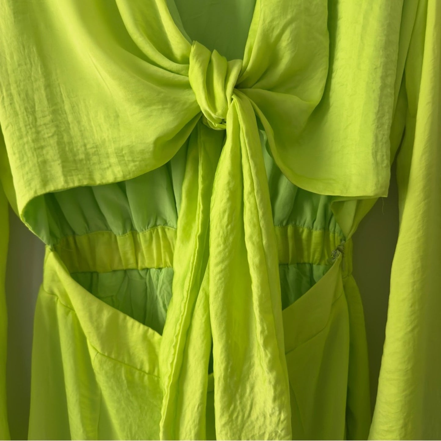 SNDYS x Revolve Pluto Romper in Neon Green Bright flared long sleeves cut out 4