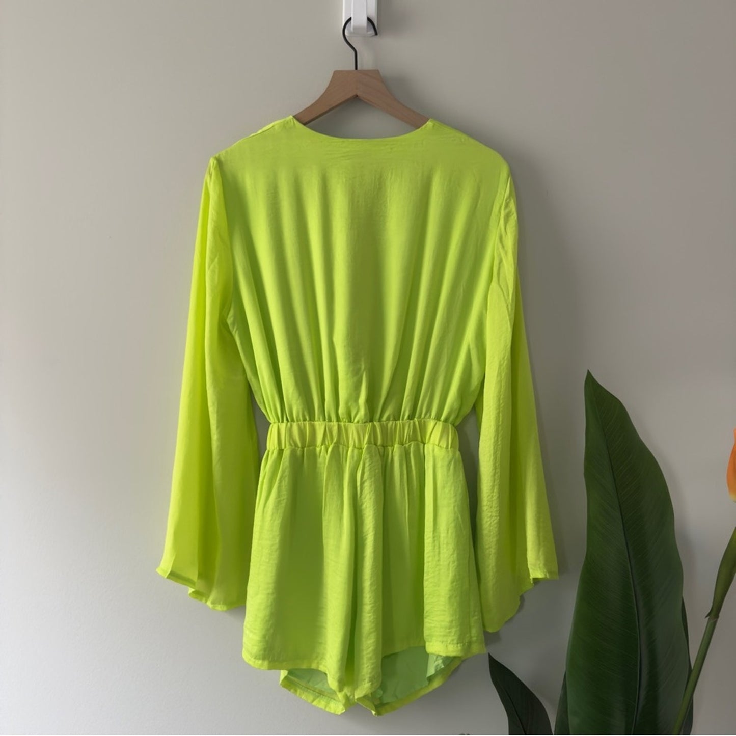 SNDYS x Revolve Pluto Romper in Neon Green Bright flared long sleeves cut out 4